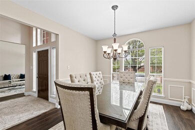 Dining space with dark wood-type flooring and a no