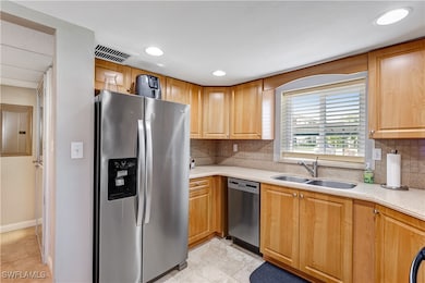 Kitchen featuring appliances with stainless steel