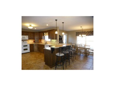 Large kitchen with updated lighting and cabinet an