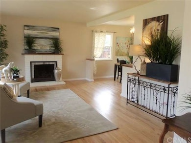 Nice size living room with a gas/wood burning fire