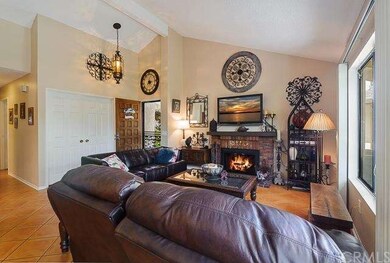 OPen living room with vaulted ceilings-with a wall