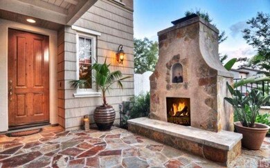 Warm outdoor fireplace welcomes your guests 