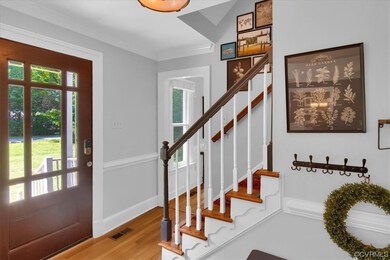 Foyer entrance featuring hardwood floors and a wea
