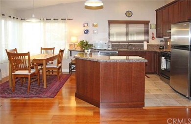 Large Windows Brighten The Eating Area and Kitchen