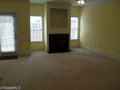 Den/Family/Great Room. Den with fireplace with gas logs and ceiling fan.