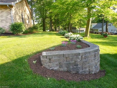 Well manicured and treed lawn.