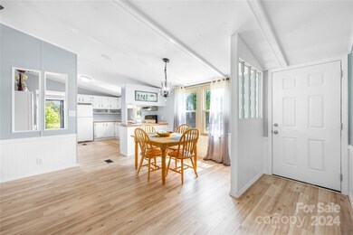 Entry way with view of dining area and kitchen