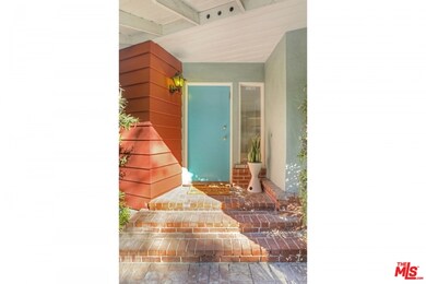 Beautiful brick entry with sidelight window