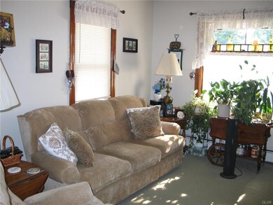 owner side living room, hot water baseboard , gas 