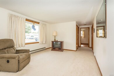 View of the length of the living room to hallway.