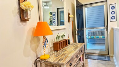 Interior space featuring ceiling fan and light til