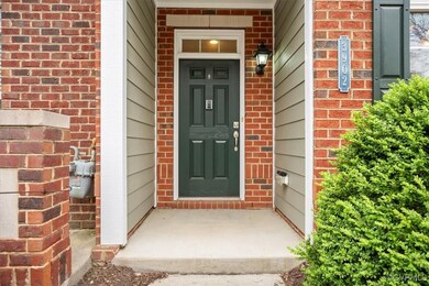 View of exterior entry featuring brick siding