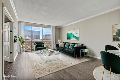 Living room featuring floor to ceiling windows, c