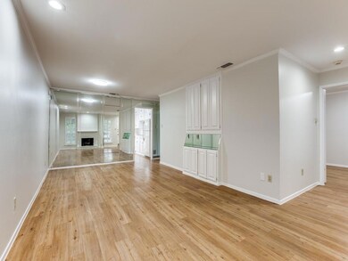 A mirrored wall reflects the beautiful living and 