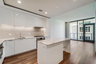 Kitchen with modern cabinets, backsplash, wood fi
