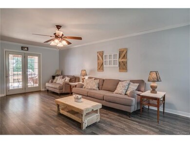 family room features New Pergo flooring, neutral c