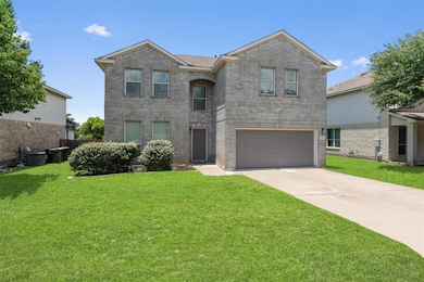 Traditional home featuring an attached garage, br