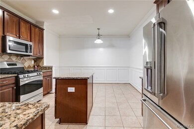 Kitchen featuring light stone countertops, hanging