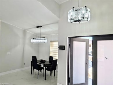Kitchen featuring visible vents, an inviting chand