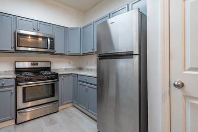 Spicket Commons unit 115, Methuen, MA 01844 - photo 7