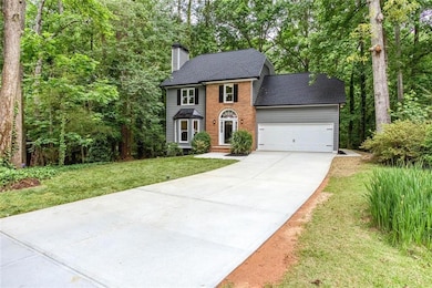 New concrete driveway, with front walkway, side walkway to large lagoon style patio.