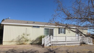 Rear view of house featuring a deck
