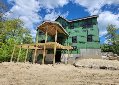 back of home with covered floating Patio Cover