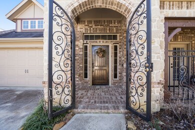 Stunning rod iron gate leading to front porch