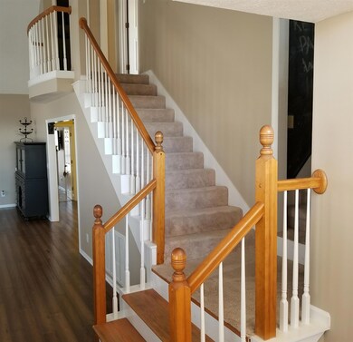 The front entry leads to a double stairway - one to bedroom area and another to the bonus room.