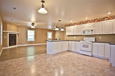 Spacious kitchen with plenty of cabinets for storage!