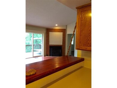 Kitchen. CUSTOM BREAKFAST BAR OVERLOOKING LIVING AREA.