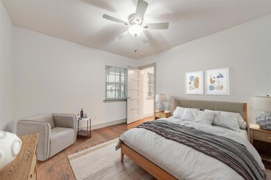 Bedroom featuring ceiling fan and light hardwood /