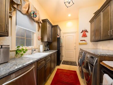 Laundry room and support kitchen including dishwas