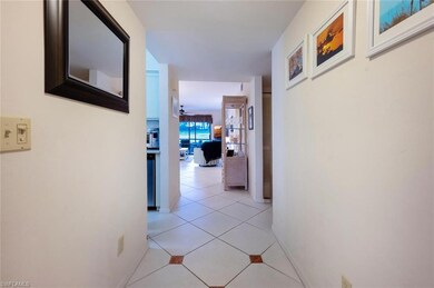 Corridor featuring light tile patterned flooring