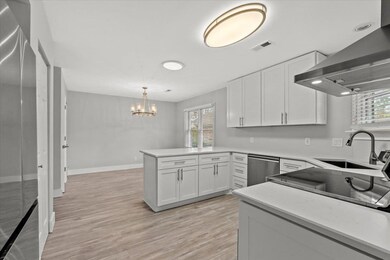 Kitchen opens to a large eating/dining area.