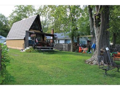 Exterior Back. A-Frame Chalet with open front porc