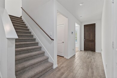Foyer entrance featuring  stairs