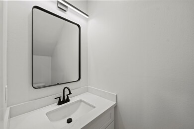 Chic and modern powder room with sleek finishes in
