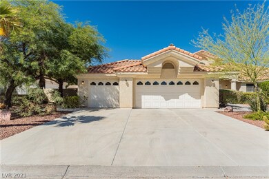 Property featured 3 car garage with long driveway.