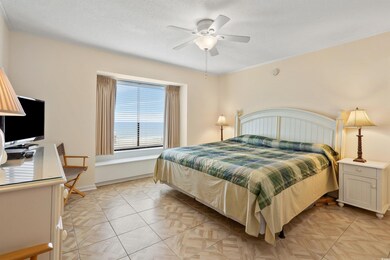 Bedroom featuring an office area, a textured ceiling, and ceiling fan