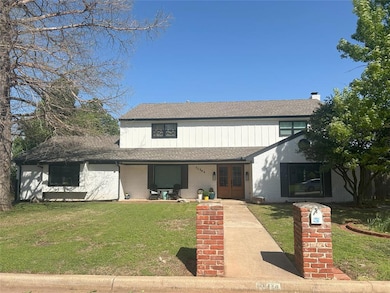 View of front of house with brick siding, french d