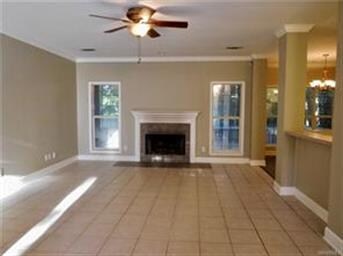 Family Room with wood burning tiled fireplace.
