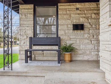 View of exterior entry with stone siding
