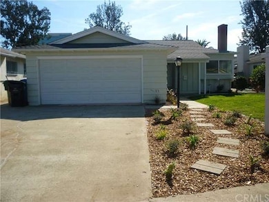 Cement driveway with stepping stones and some drou