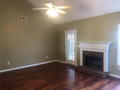Unfurnished living room with baseboards, a firepla