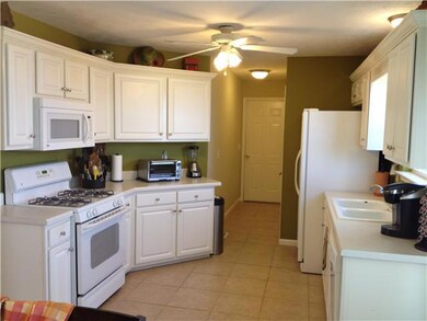 Clean, light and bright kitchen with gas stove.  Washer and dryer is located down the hall and stays with the home.
