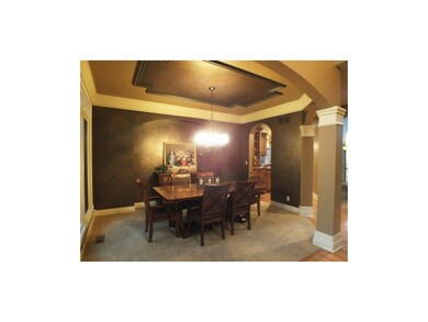Elegant formal dining room with gold and bronze fa