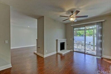 Dining room features dark wood laminate flooring w