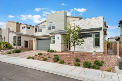 View of front of home with concrete driveway, an a