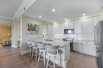 Kitchen featuring stainless steel appliances, ligh
